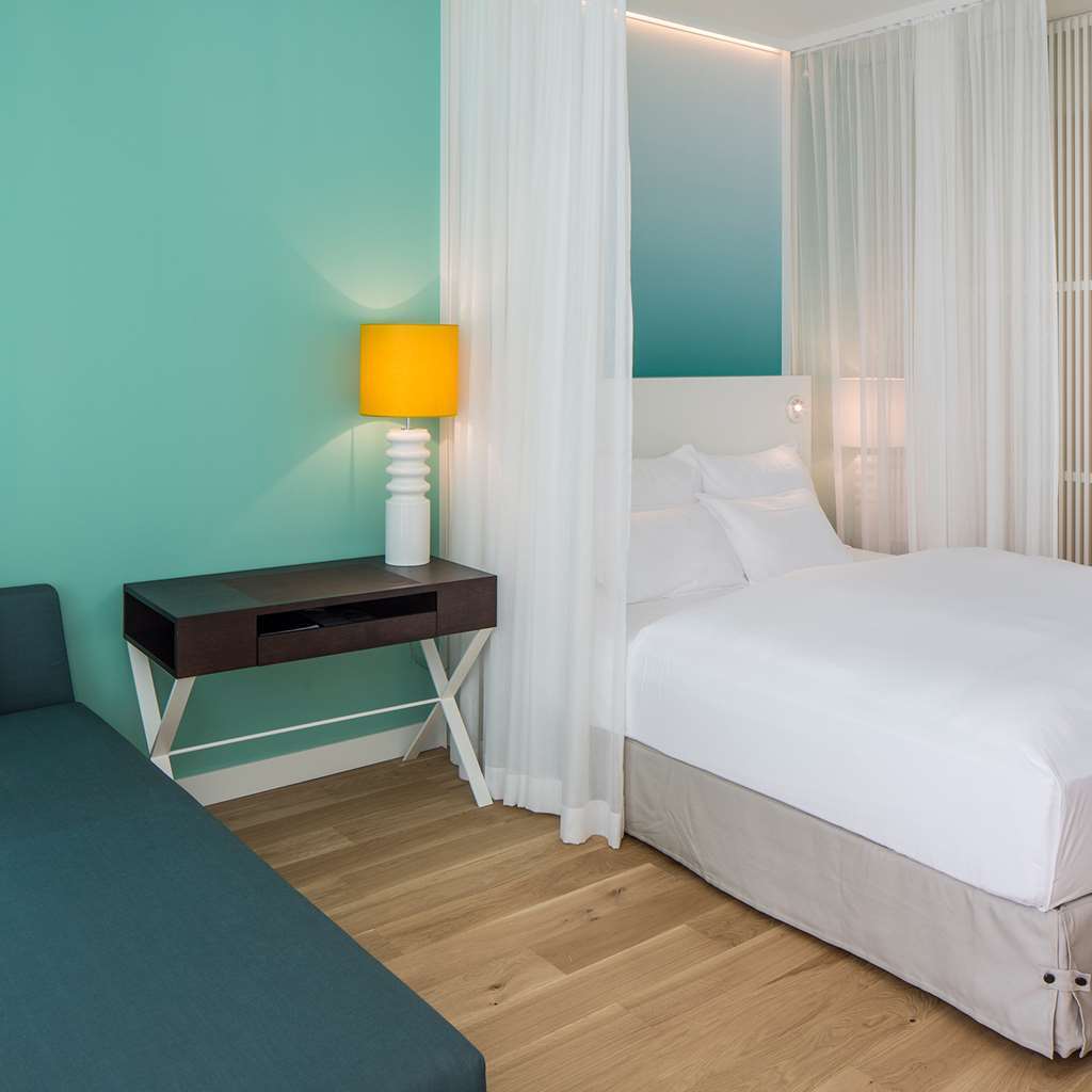 Falkensteiner Hotel & Spa Jesolo Phòng bức ảnh A bedroom at the hotel
